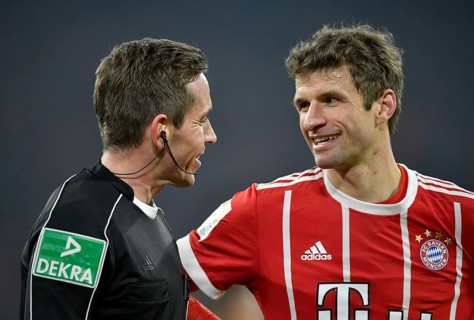 Referee Tobias Stieler in friendly dialogue with Thomas Muller of FC Bayern Munich
