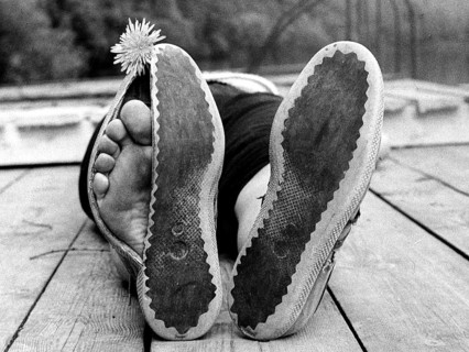 Toes peeking out of broken shoes ca. 1970s