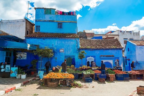 Locals buying vegetables and fruits
