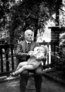 Grandpa gives bottles ca. 1926