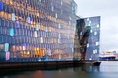 Facade of the honeycomb structure made of dichromatic glass by Olafur Eliasson at the Harpa Concert Hall
