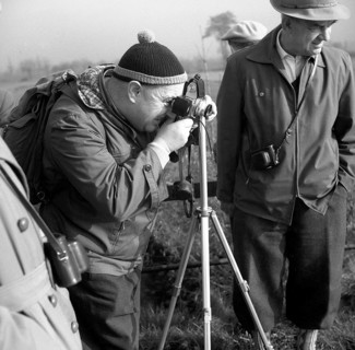 Men photographing with tripod around 1950