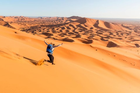Woman running downhill