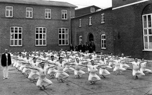 Group of men in the yard during their morning sports