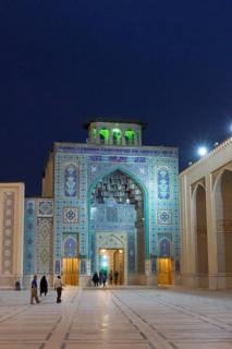 Entrance of Aramgah-e Shah-e Cheragh complex at night