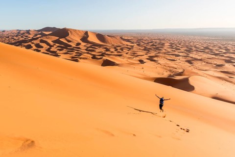 Woman running downhill