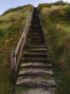 Wooden stair to the lookout on a sand dune