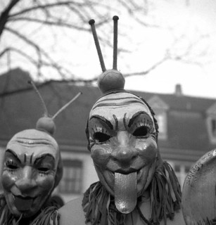 Men with mask stick their tongues out