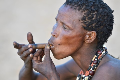 Old San woman smoking