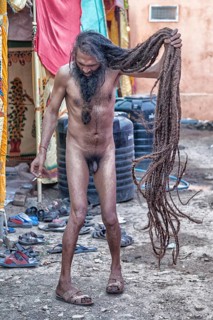 Naked Sadhu with long hair during Hindu festival Kumbh Mela