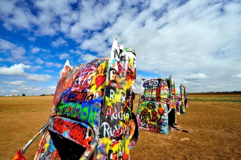 Painted Cadillacs rammed into the ground