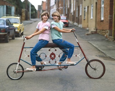 Two girls driving tandem