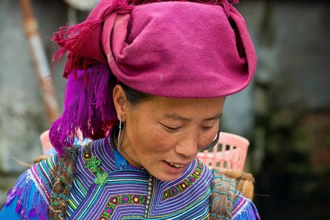 Woman in traditional dress of the Flower Hmong