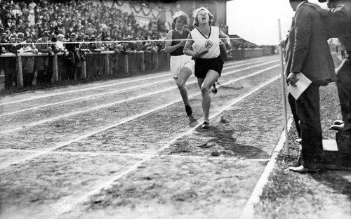 Two female runners at the finish line
