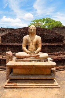 Ruin of a temple with moonstone and Buddha statue