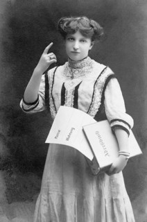 Woman with raised index finger