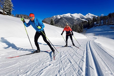 Olympic silver medalist Tobi Angerer with his wife Romy on the cross-country ski trail of Winklmoos-Alm