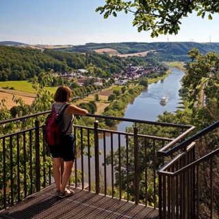 Woman looks from the Skywalk on the Weser
