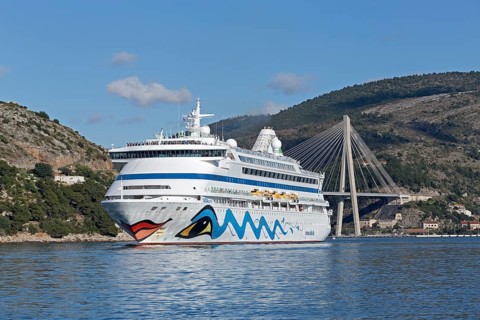 Cruise liner AIDAaura with Franjo-Tudman Bridge