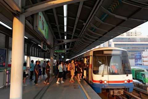 People board the BTS Skytrain in the morning