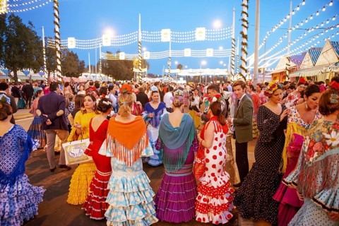 Spanish women with colorful flamenco dresses