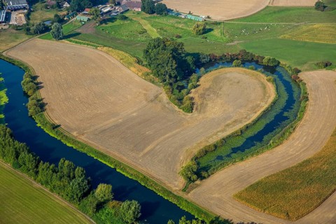 Altarm der Lippe between mown fields