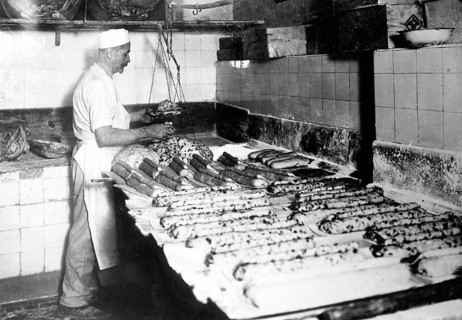 Baker bakes Dresden Christstollen ca. 1930