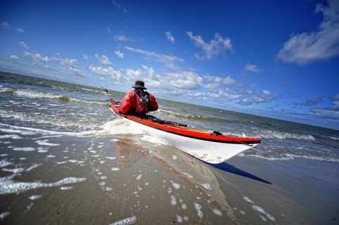 Canoeist in the surf on the beach of Langeoog