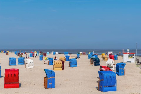 Sandy beach with beach chairs at the North Sea