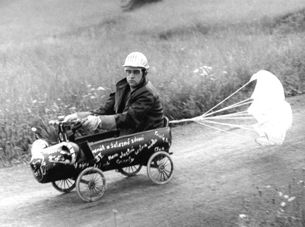 Man in soapbox with brake parachute ca. 1970s