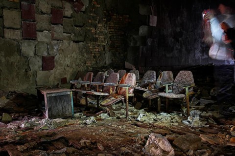 Cinema chairs in a destroyed building