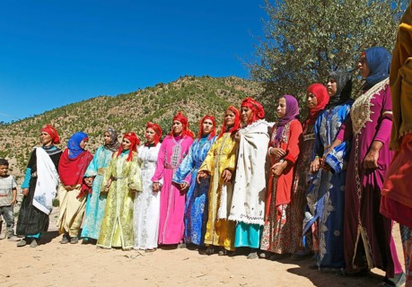 Dancing women in colorful dresses