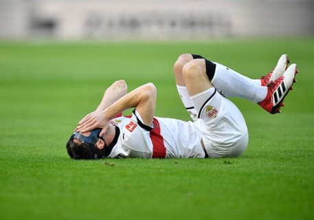 Christian Gentner of VfB Stuttgart lying injured on the ground