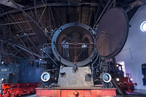 Tender locomotive 95 016 with open smoke chamber in a former railway depot