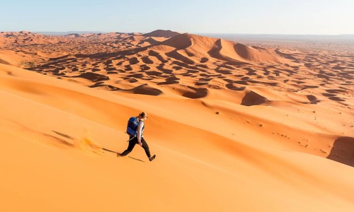 Woman running downhill