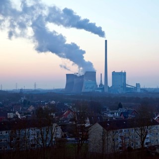 Housing estate with the Gersteinwerk power plant at sunset