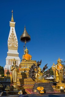 Golden Buddha statues in front of the Chedi of Wat Phra That Phanom