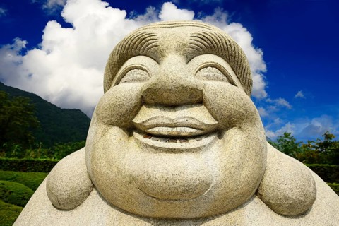 Ebisu Buddha with coins in his mouth