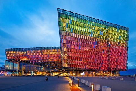 Illuminated Harpa Concert Hall at dusk