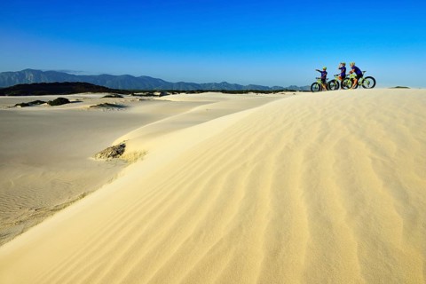 Mountain biking with fat bikes on sand dunes