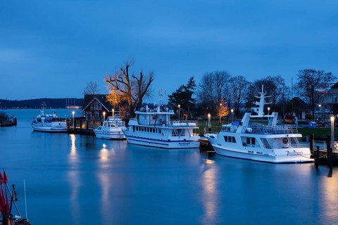Baltic Sea harbour with boats at dusk