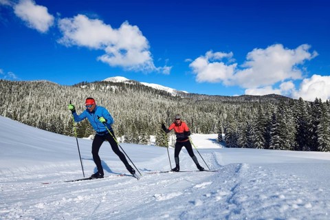 Olympic silver medalist Tobi Angerer with his wife Romy on the cross-country ski trail of Winklmoos-Alm