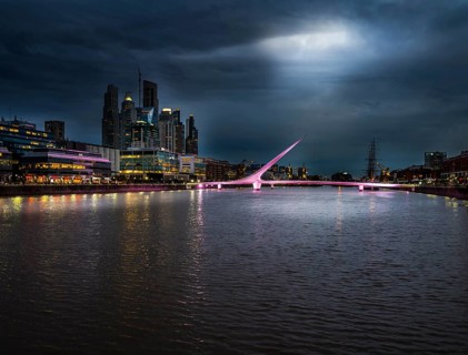 High-rise buildings at the South Dock with bridge Puente de la Mujer over the river Rio de la Plata