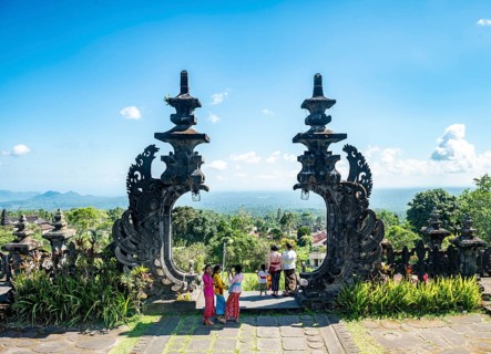 Young Balinese women at the gateway to a temple