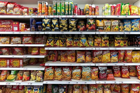 Snacks and chips in a supermarket shelf