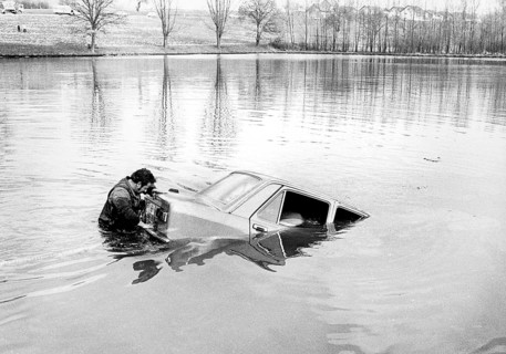 Man with car in the water