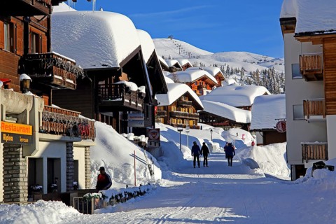 Village road with snow-covered chalets