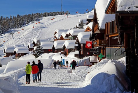 Village road with snow-covered chalets
