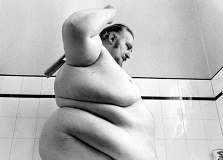 Big man washes himself