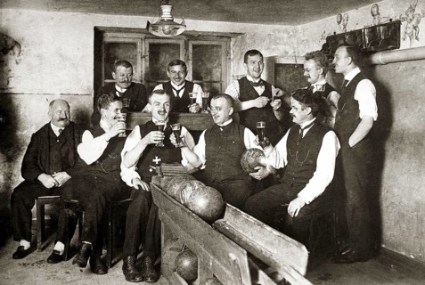 Men in sociable bowling and drinking beer